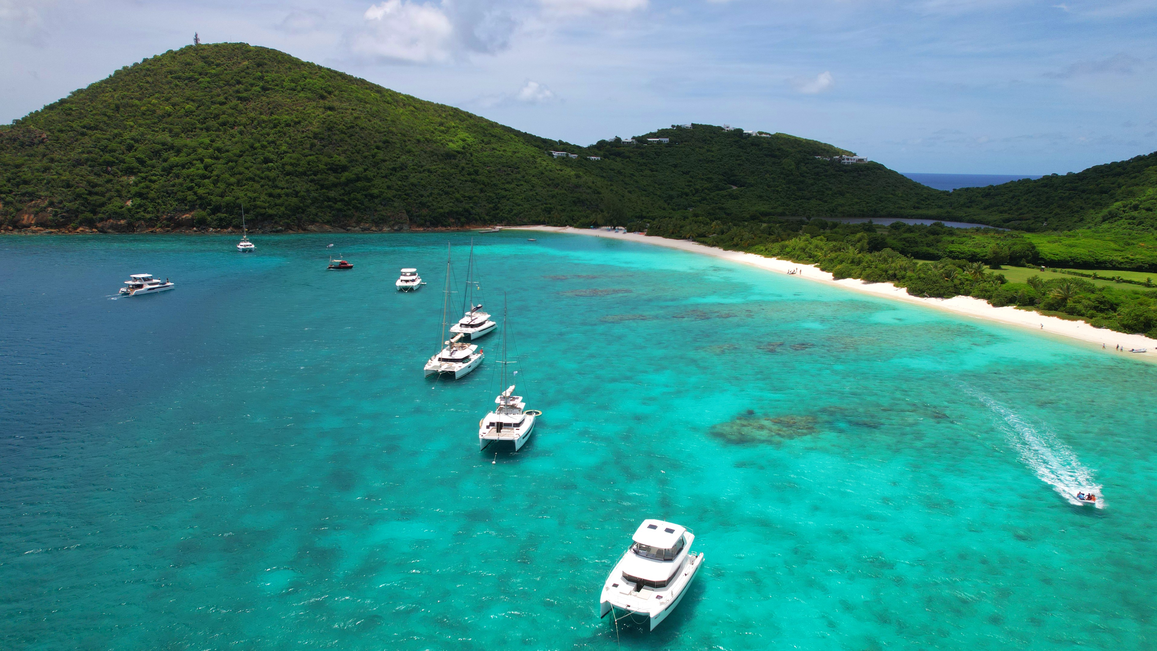 Charter yachts anchored in turquoise Caribbean waters